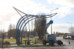 Contractors move the whale sculpture into place on the Corner of Elles Road and Dalrymple Street. Photograph: Andrei Robertson